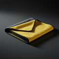 Premium grey and yellow dual-sided microfiber detailing towel on dark background
